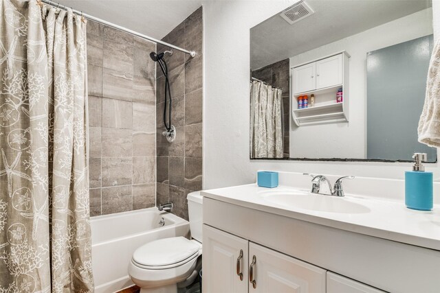 full bathroom featuring shower / bathtub combination with curtain, toilet, and vanity