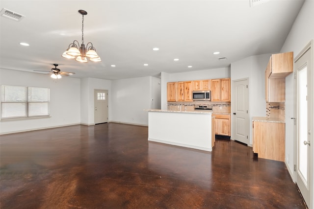 kitchen with ceiling fan with notable chandelier, tasteful backsplash, light stone countertops, hanging light fixtures, and appliances with stainless steel finishes