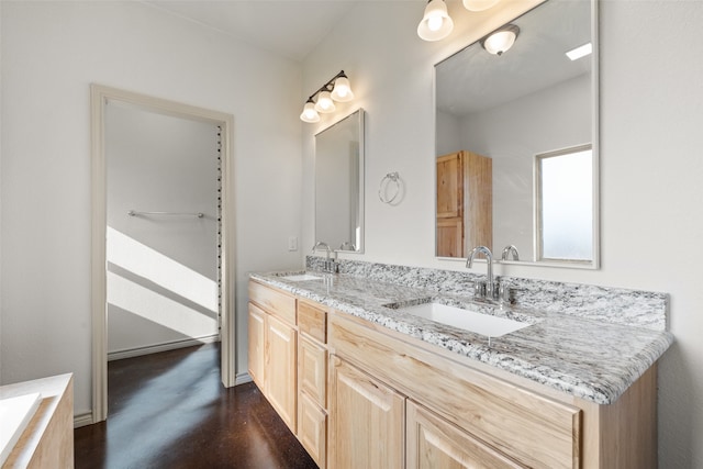 bathroom featuring vanity and hardwood / wood-style floors