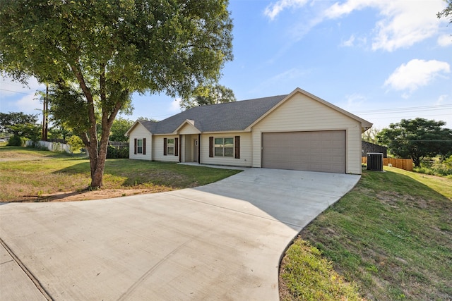 single story home with a front lawn, a garage, and central AC