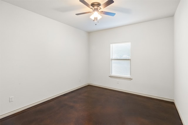 spare room with concrete floors and ceiling fan