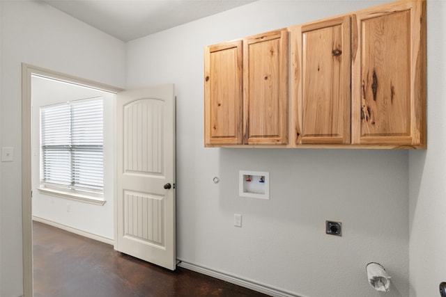 washroom with cabinets, hookup for a gas dryer, electric dryer hookup, and washer hookup