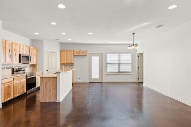 kitchen featuring a kitchen island with sink, pendant lighting, a chandelier, light stone countertops, and appliances with stainless steel finishes