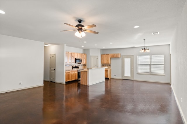 unfurnished living room featuring ceiling fan with notable chandelier