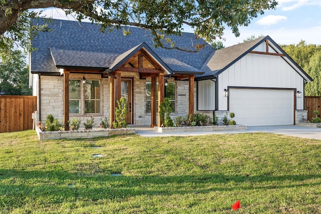 view of front of property featuring a garage and a front yard