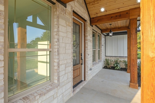 property entrance with covered porch