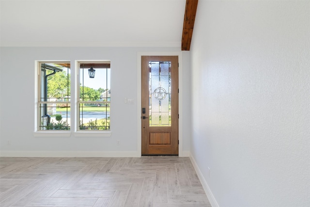 foyer with light parquet floors and beamed ceiling