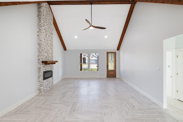 unfurnished living room with beamed ceiling, a stone fireplace, ceiling fan, high vaulted ceiling, and light parquet floors