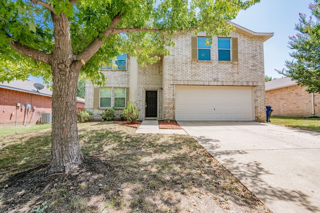 view of front of house with a garage and central AC