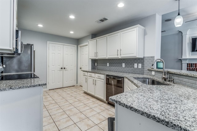 kitchen with sink, pendant lighting, white cabinets, and dishwasher