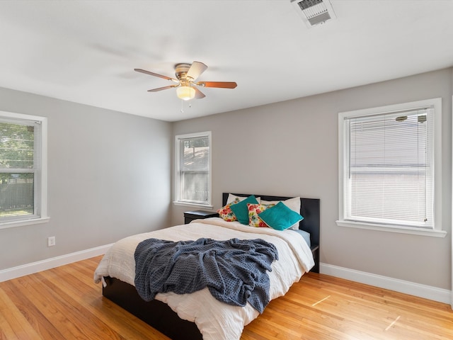 bedroom featuring ceiling fan and light hardwood / wood-style floors