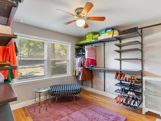 bedroom with ceiling fan and light wood-type flooring