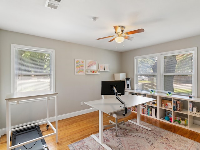 office space featuring light hardwood / wood-style flooring and ceiling fan