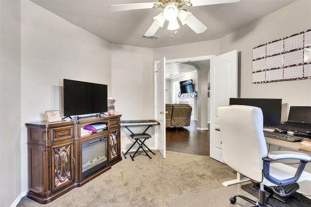 home office featuring ceiling fan and carpet flooring