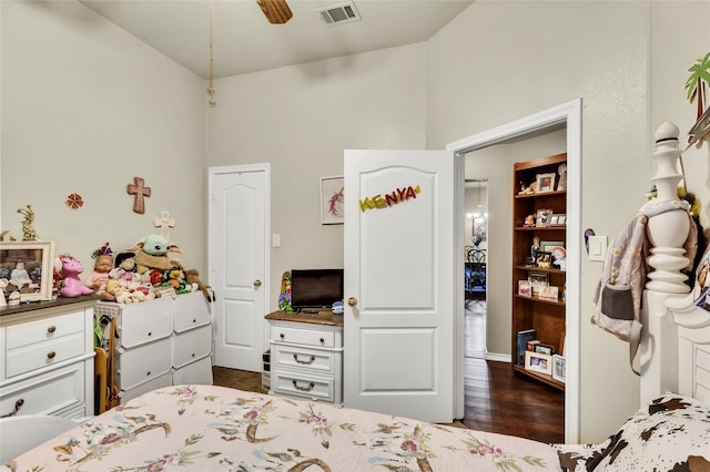 bedroom with dark wood-type flooring