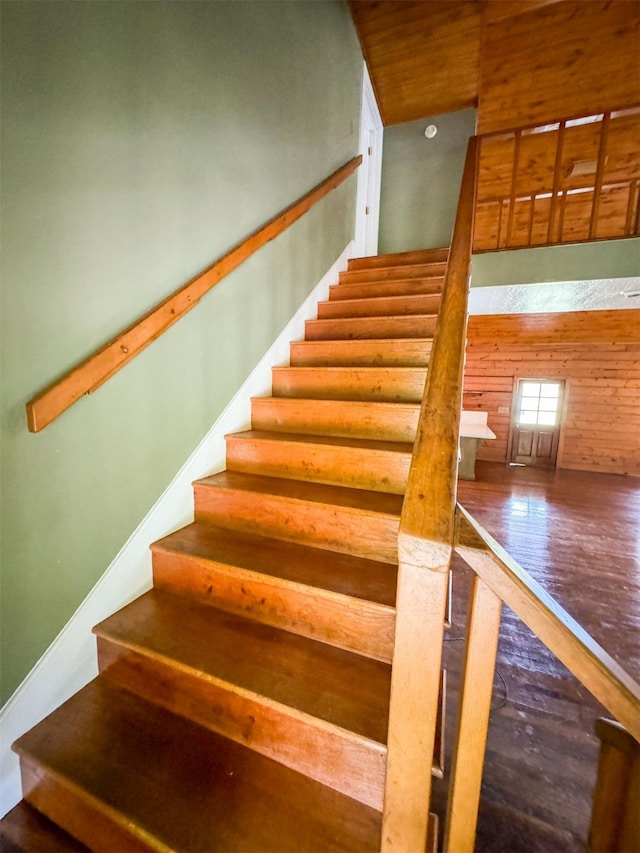 stairway with hardwood / wood-style floors