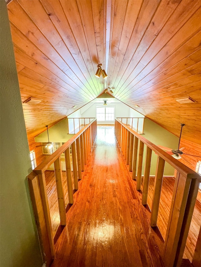 hallway with wooden ceiling, lofted ceiling, and hardwood / wood-style floors