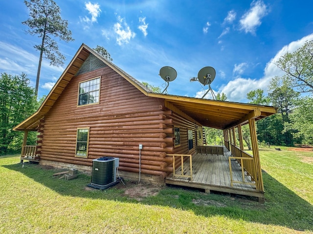 view of home's exterior featuring a yard and central AC