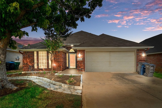 ranch-style home featuring a garage