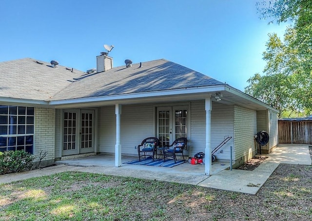 rear view of house featuring a patio and french doors