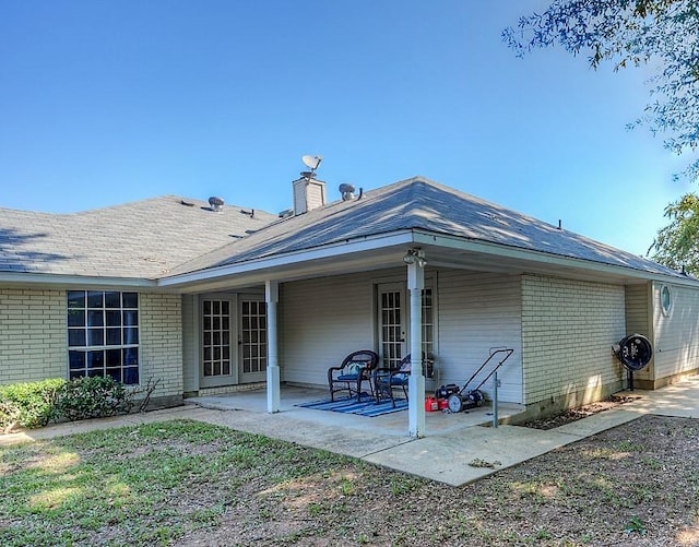 rear view of property featuring a patio area