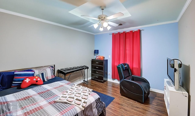 bedroom with crown molding, ceiling fan, and dark hardwood / wood-style flooring