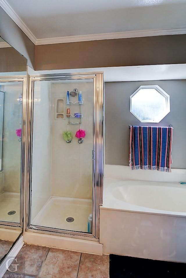 bathroom featuring tile patterned floors, ornamental molding, and independent shower and bath