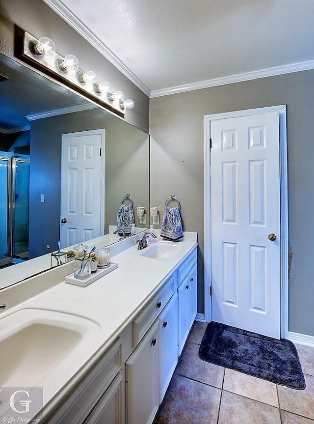 bathroom featuring ornamental molding, vanity, tile patterned floors, and a shower with shower door