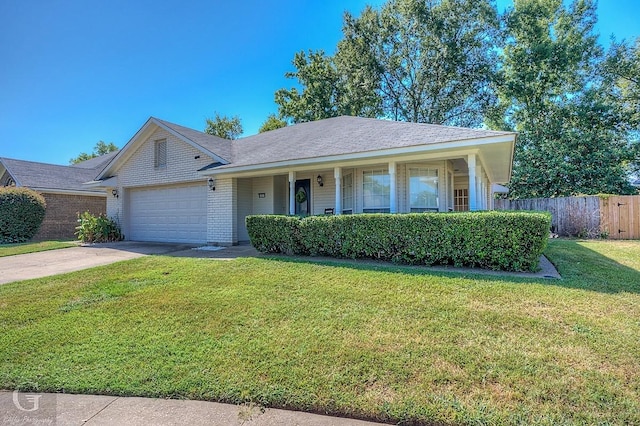 single story home with a garage and a front lawn