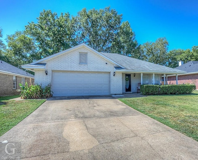 ranch-style home featuring a garage and a front yard