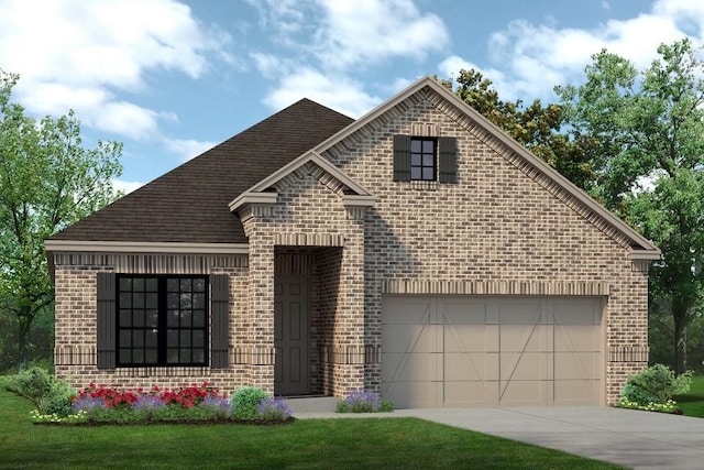 view of front of property with a garage and a front yard