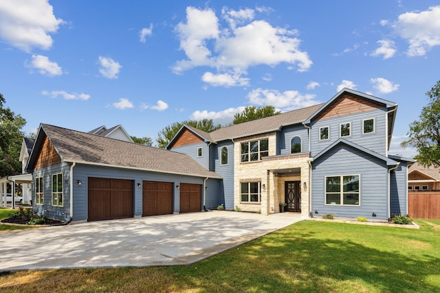 view of property with a garage and a front yard