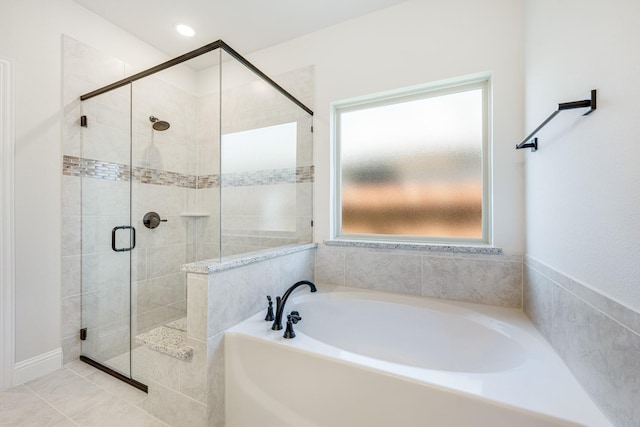 bathroom with shower with separate bathtub