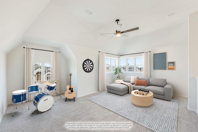 carpeted living room featuring ceiling fan and lofted ceiling