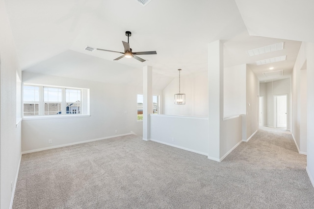 spare room featuring ceiling fan, plenty of natural light, and light colored carpet