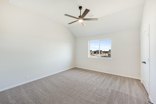 spare room with carpet flooring, ceiling fan, and lofted ceiling