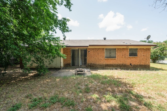 back of house with a patio