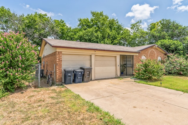 garage featuring a lawn