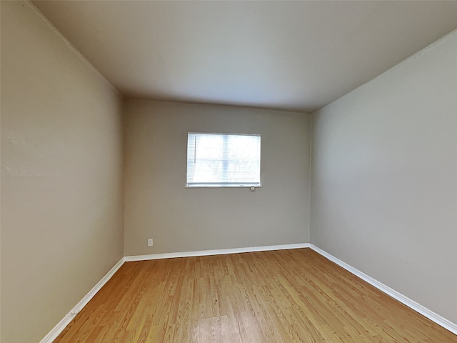 spare room with light hardwood / wood-style flooring