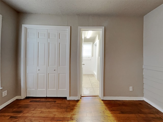 unfurnished bedroom featuring hardwood / wood-style flooring