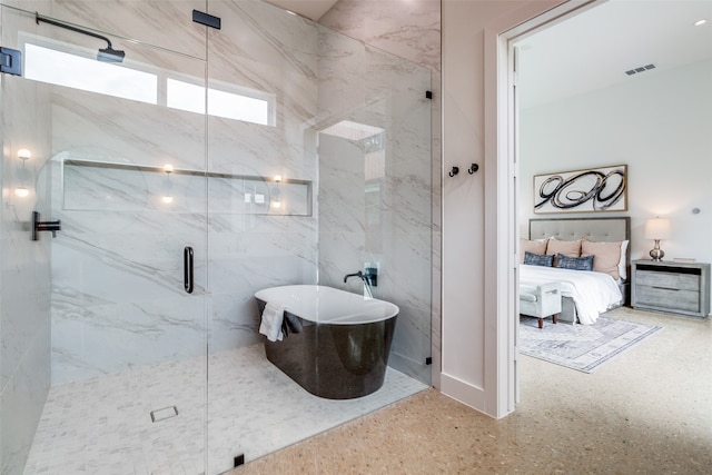 bathroom featuring a shower with door and tile walls