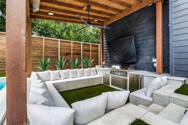 view of patio with area for grilling, an outdoor hangout area, and a grill