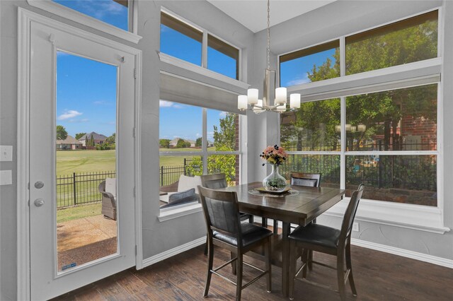 dining area with dark hardwood / wood-style floors and plenty of natural light