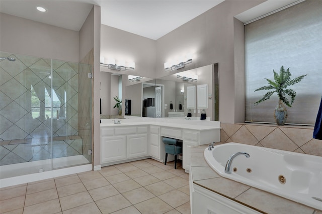 bathroom with vanity, plus walk in shower, and tile patterned floors