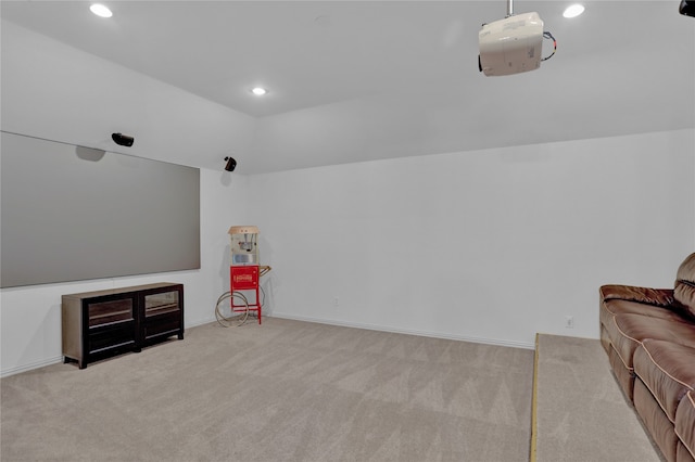 interior space featuring light colored carpet and vaulted ceiling