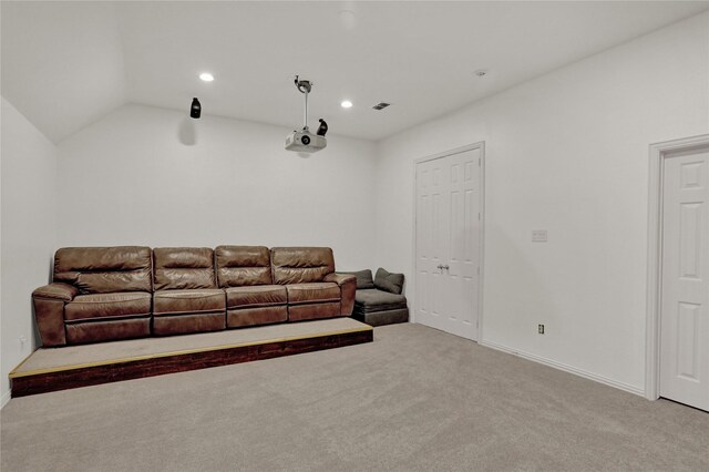 living room featuring light carpet and lofted ceiling