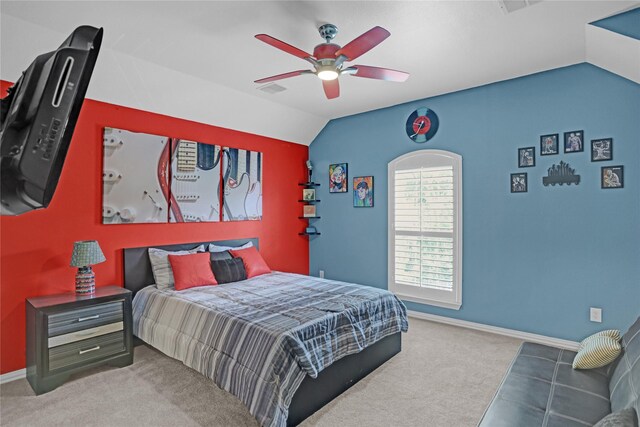 bedroom with vaulted ceiling, ceiling fan, and carpet floors