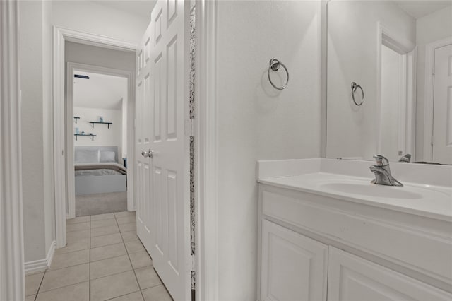 bathroom featuring tile patterned flooring and vanity