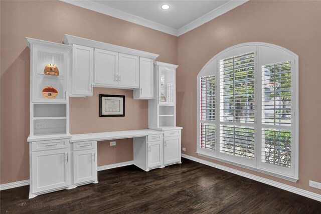 unfurnished office featuring dark hardwood / wood-style floors and crown molding