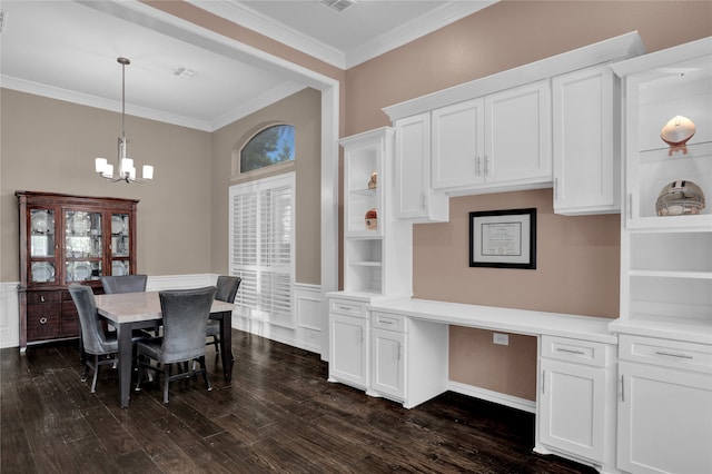 dining area with ornamental molding, dark wood-type flooring, and a chandelier